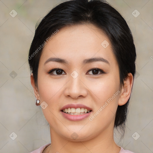 Joyful asian young-adult female with medium  black hair and brown eyes