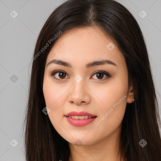 Joyful asian young-adult female with long  brown hair and brown eyes