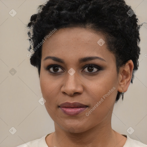 Joyful black young-adult female with short  brown hair and brown eyes