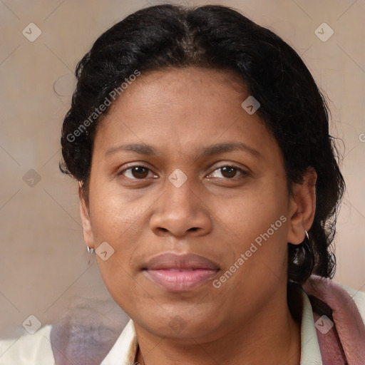 Joyful latino adult female with medium  brown hair and brown eyes