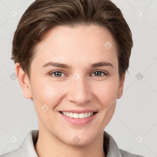 Joyful white young-adult female with short  brown hair and grey eyes