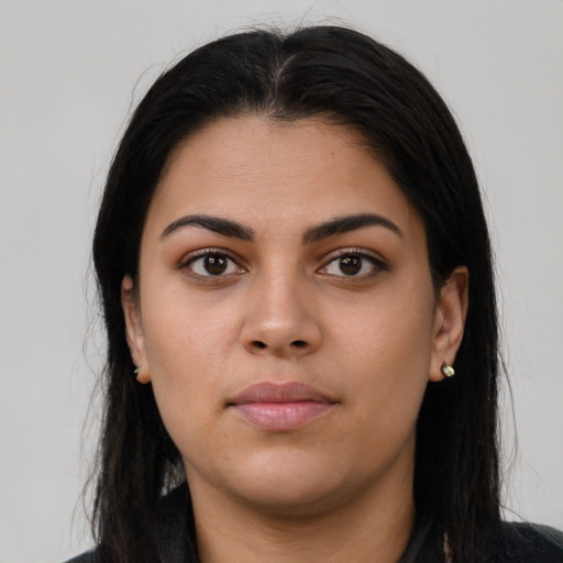 Neutral latino young-adult female with long  brown hair and brown eyes