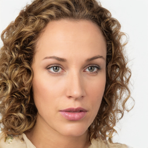 Neutral white young-adult female with long  brown hair and green eyes