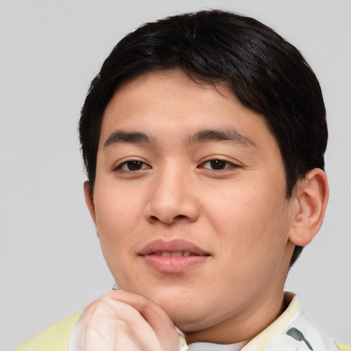 Joyful asian young-adult male with short  brown hair and brown eyes