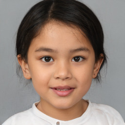 Joyful white child female with medium  brown hair and brown eyes