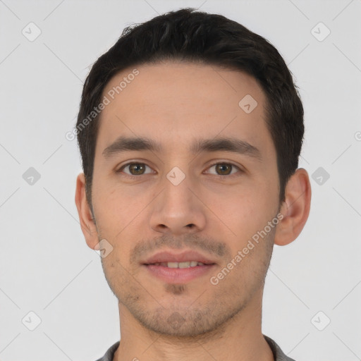 Joyful white young-adult male with short  black hair and brown eyes