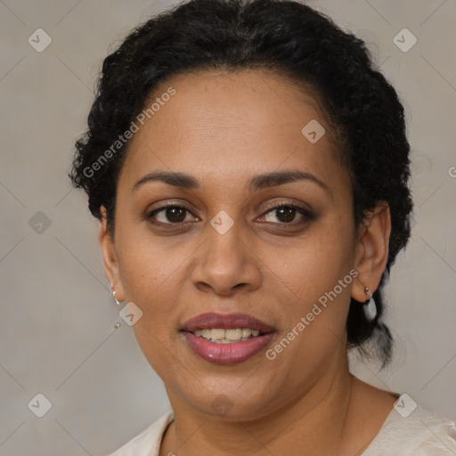 Joyful latino adult female with short  brown hair and brown eyes