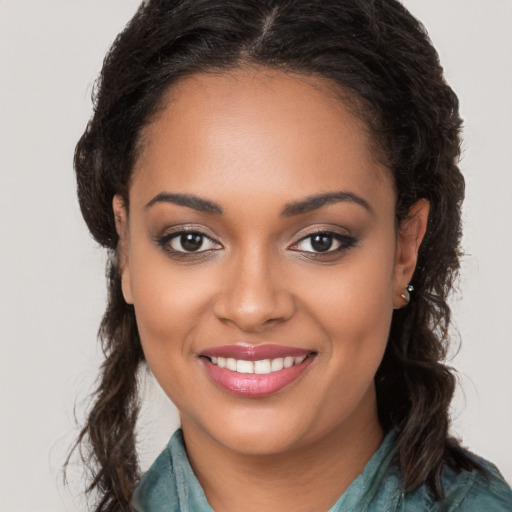 Joyful latino young-adult female with long  brown hair and brown eyes