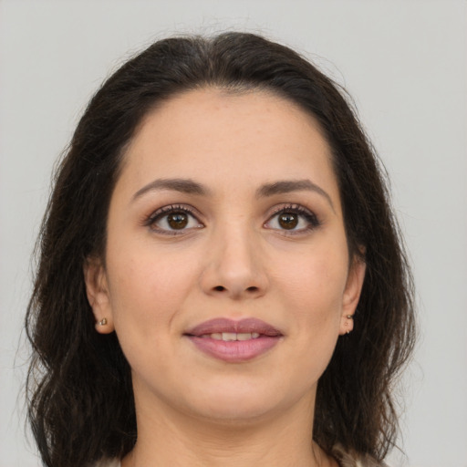 Joyful white young-adult female with long  brown hair and brown eyes