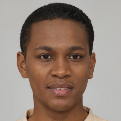 Joyful black young-adult male with short  brown hair and brown eyes
