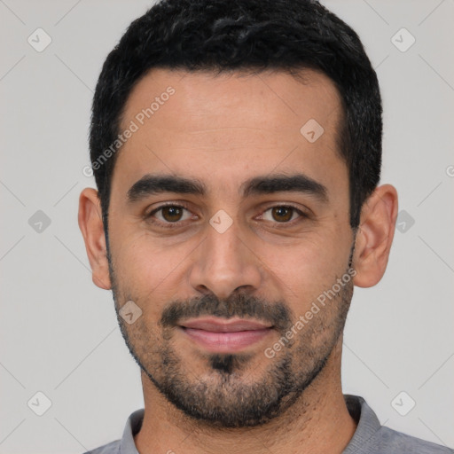 Joyful white young-adult male with short  black hair and brown eyes