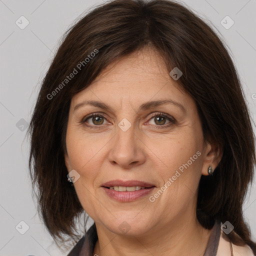 Joyful white adult female with medium  brown hair and brown eyes