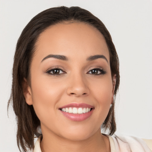 Joyful white young-adult female with medium  brown hair and brown eyes