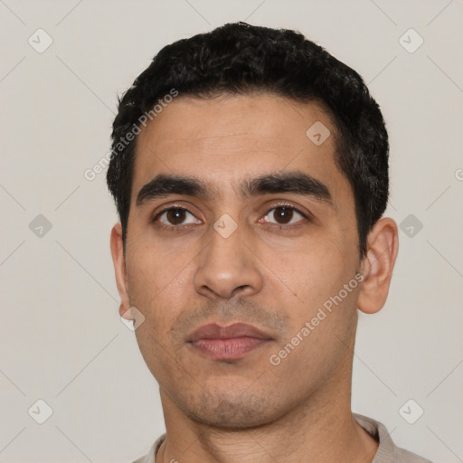 Neutral latino young-adult male with short  black hair and brown eyes