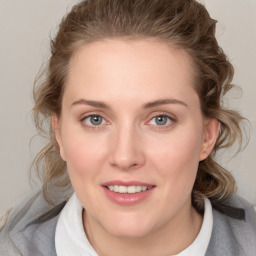 Joyful white young-adult female with medium  brown hair and blue eyes