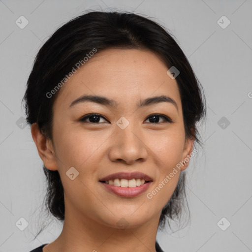 Joyful asian young-adult female with medium  black hair and brown eyes