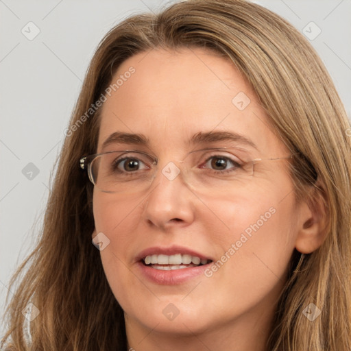 Joyful white adult female with long  brown hair and brown eyes