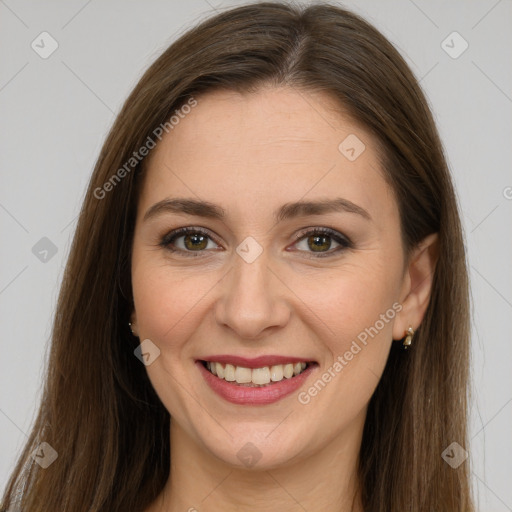 Joyful white young-adult female with long  brown hair and brown eyes