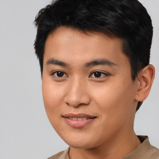 Joyful asian young-adult male with short  brown hair and brown eyes