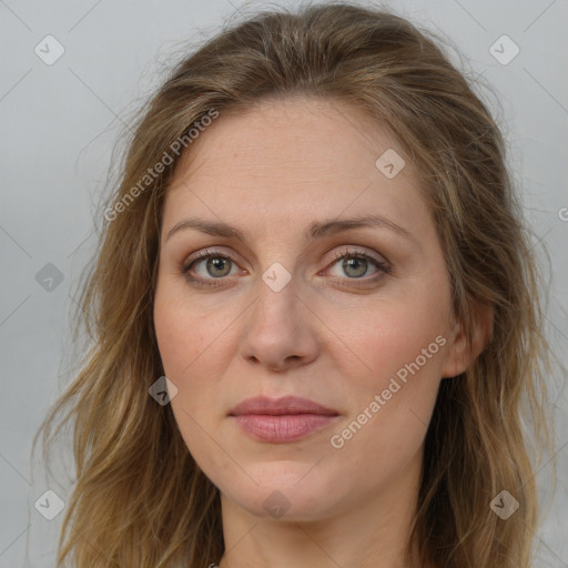 Joyful white young-adult female with long  brown hair and green eyes