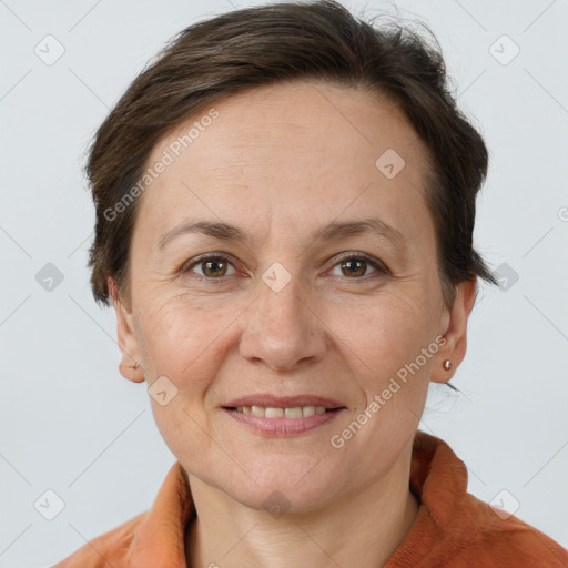 Joyful white adult female with short  brown hair and brown eyes