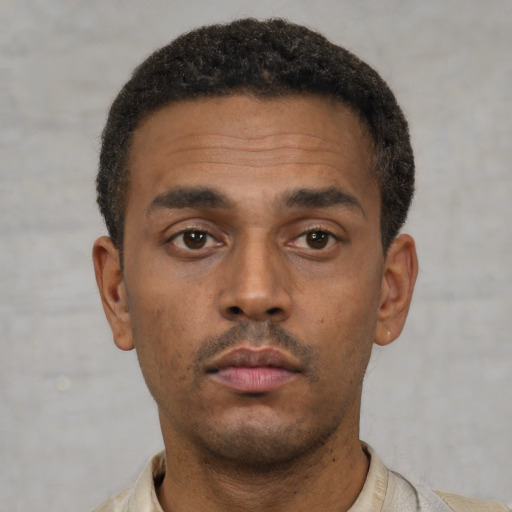 Neutral latino young-adult male with short  brown hair and brown eyes