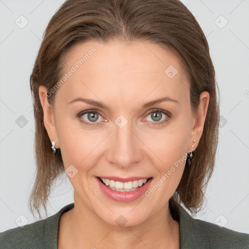 Joyful white young-adult female with medium  brown hair and grey eyes