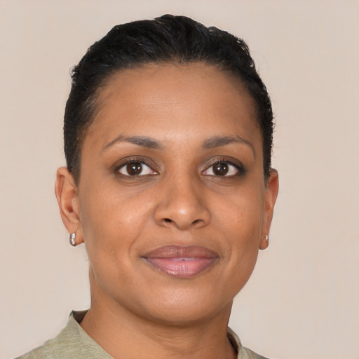 Joyful black young-adult female with short  brown hair and brown eyes
