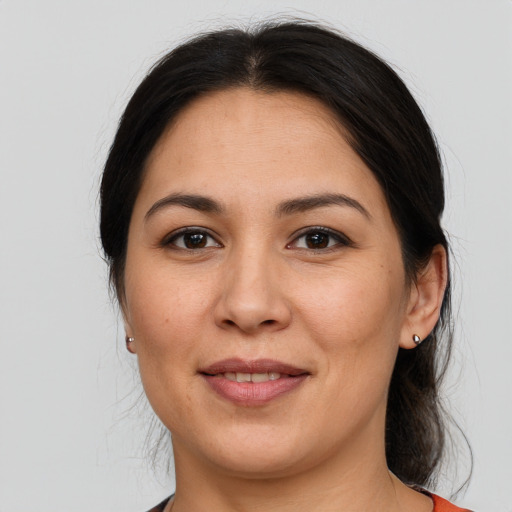 Joyful white adult female with medium  brown hair and brown eyes