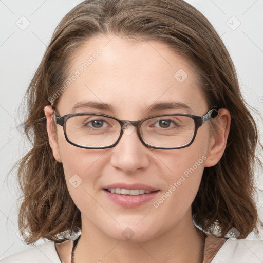 Joyful white young-adult female with medium  brown hair and blue eyes