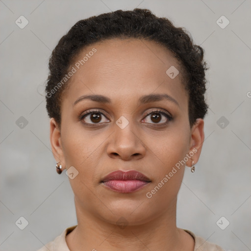 Joyful black young-adult female with short  brown hair and brown eyes