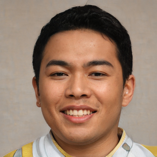 Joyful asian young-adult male with short  black hair and brown eyes