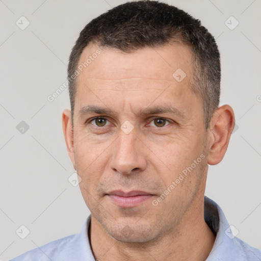 Joyful white adult male with short  brown hair and brown eyes