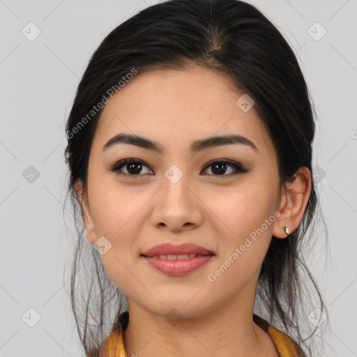 Joyful asian young-adult female with medium  brown hair and brown eyes