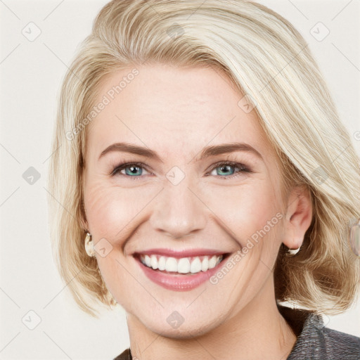 Joyful white young-adult female with medium  brown hair and blue eyes