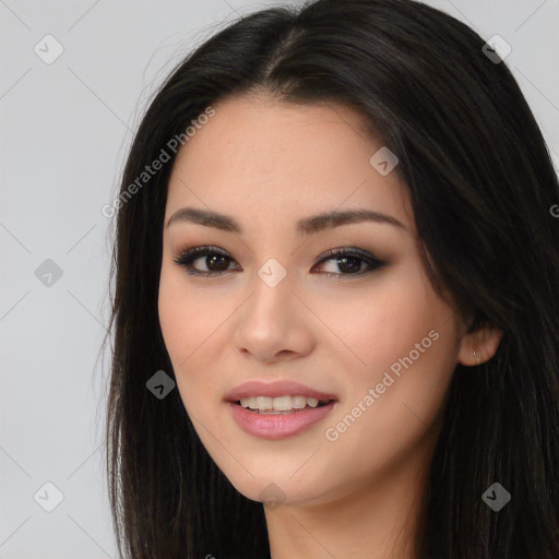 Joyful asian young-adult female with long  brown hair and brown eyes