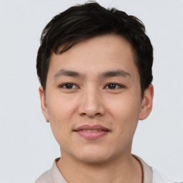 Joyful asian young-adult male with short  black hair and brown eyes