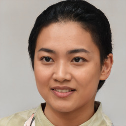 Joyful asian young-adult female with short  black hair and brown eyes