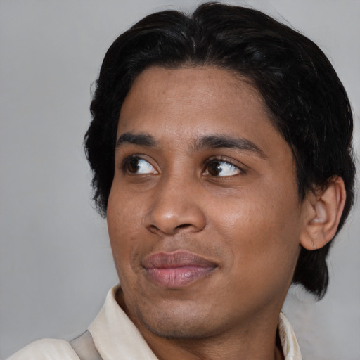 Joyful asian young-adult male with medium  brown hair and brown eyes