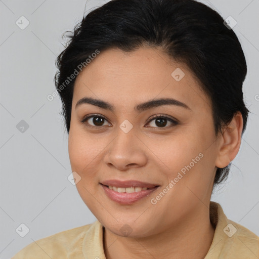 Joyful latino young-adult female with medium  brown hair and brown eyes