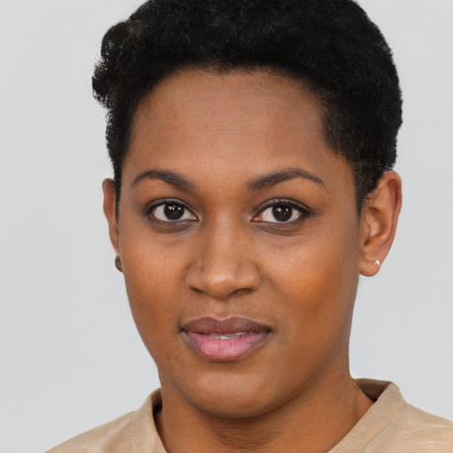 Joyful black young-adult female with short  black hair and brown eyes
