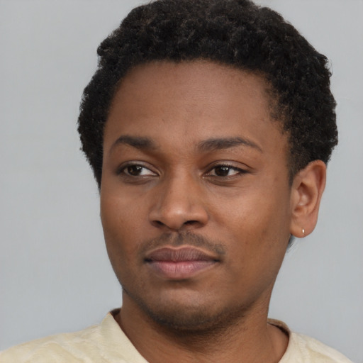 Neutral latino young-adult male with short  brown hair and brown eyes