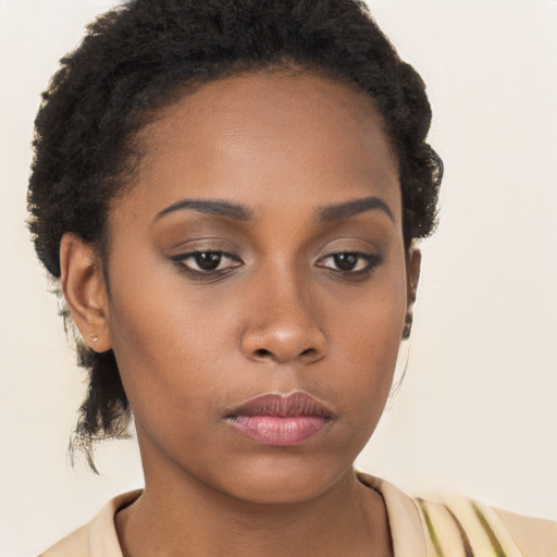 Neutral black young-adult female with long  brown hair and brown eyes