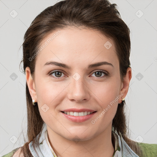 Joyful white young-adult female with medium  brown hair and grey eyes