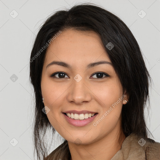 Joyful latino young-adult female with long  brown hair and brown eyes