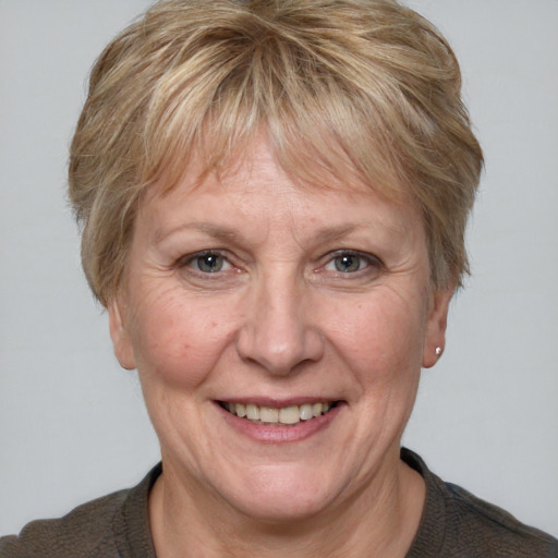 Joyful white middle-aged female with medium  brown hair and brown eyes