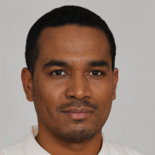 Neutral black young-adult male with short  black hair and brown eyes