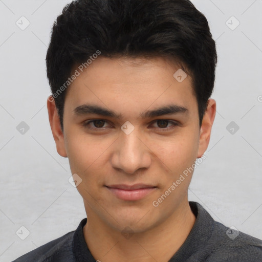 Joyful asian young-adult male with short  black hair and brown eyes