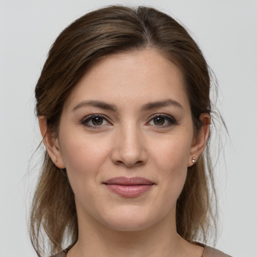 Joyful white young-adult female with medium  brown hair and brown eyes