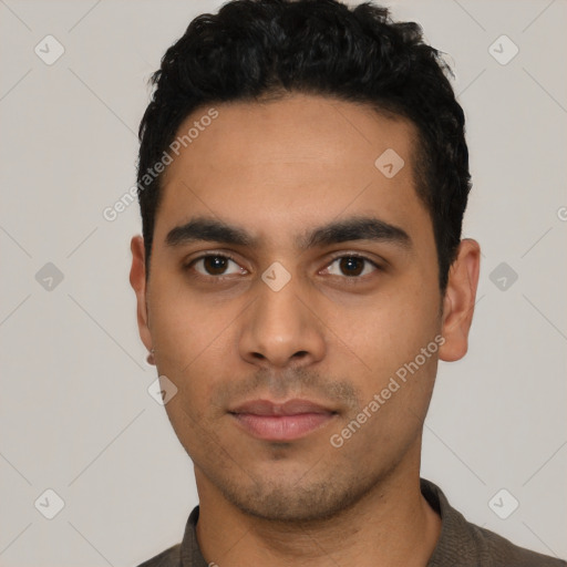 Neutral latino young-adult male with short  black hair and brown eyes